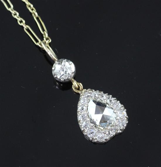 A Victorian style gold and diamond inverted heart shape pendant necklace, 0.75in inc. bale.